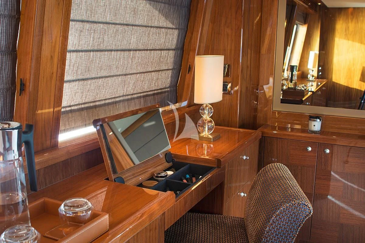 a laptop on a table aboard PATHOS Yacht for Sale