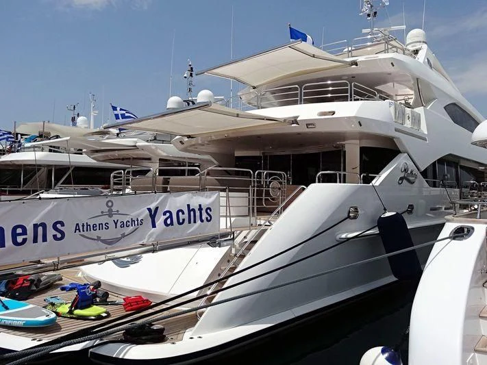 a boat docked at a pier aboard PATHOS Yacht for Sale