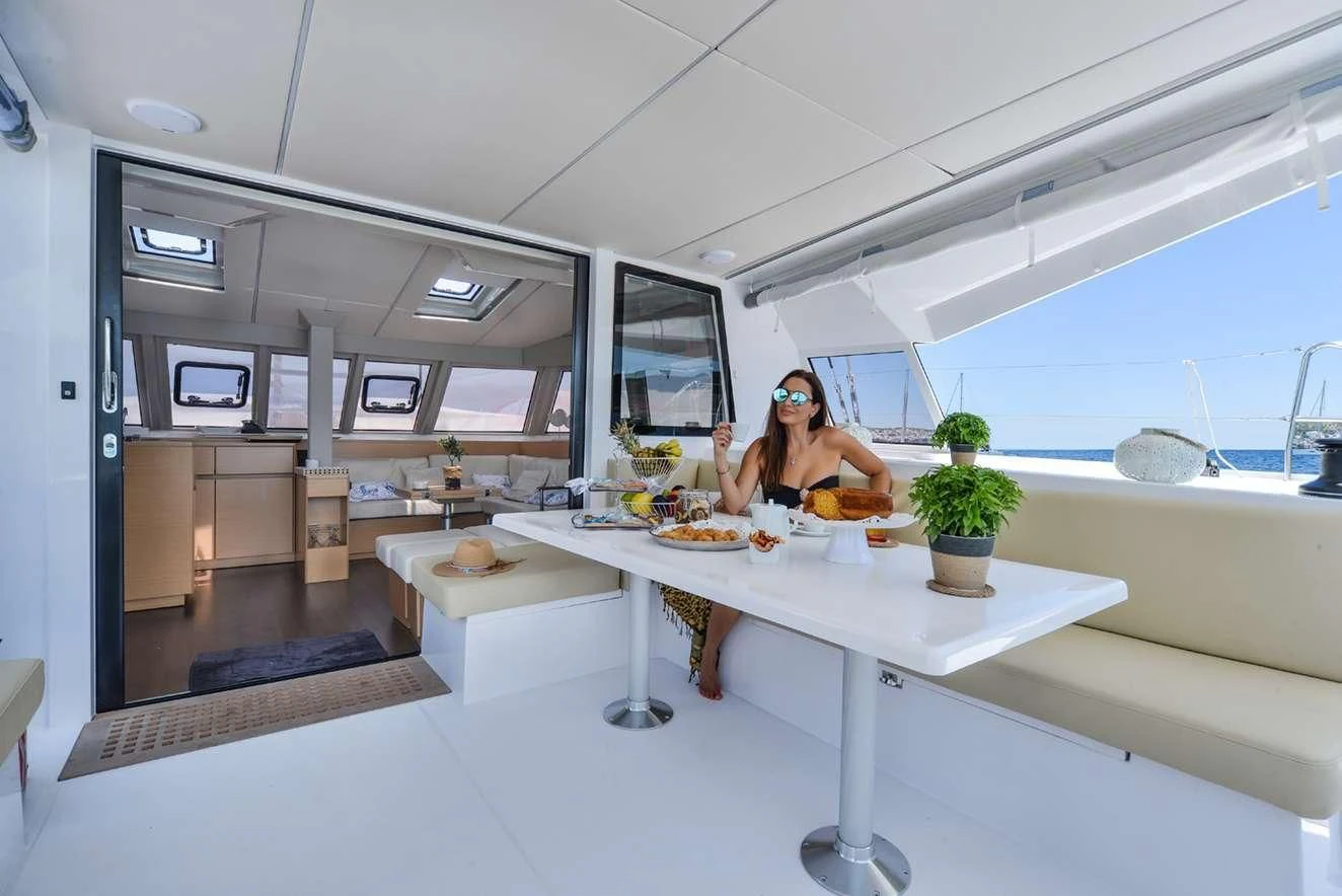 a person sitting at a table aboard ROSE PIGRE Yacht for Sale