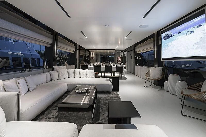 a living room with a large screen aboard NEWAL Yacht for Sale