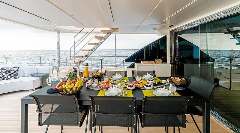 a table with food on it aboard NEWAL Yacht for Sale