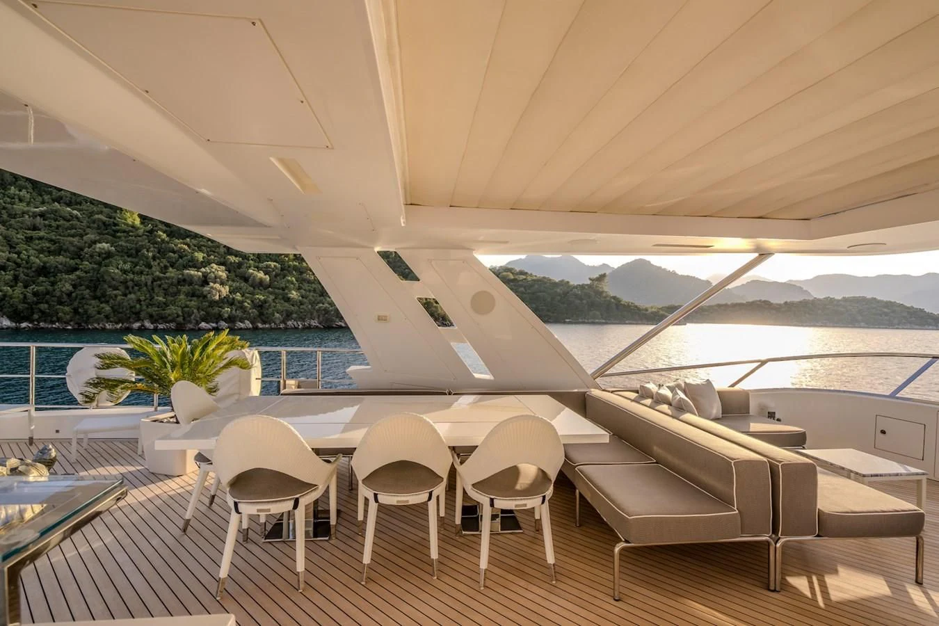 a room with a table chairs and a pool aboard CHARISMA Yacht for Sale