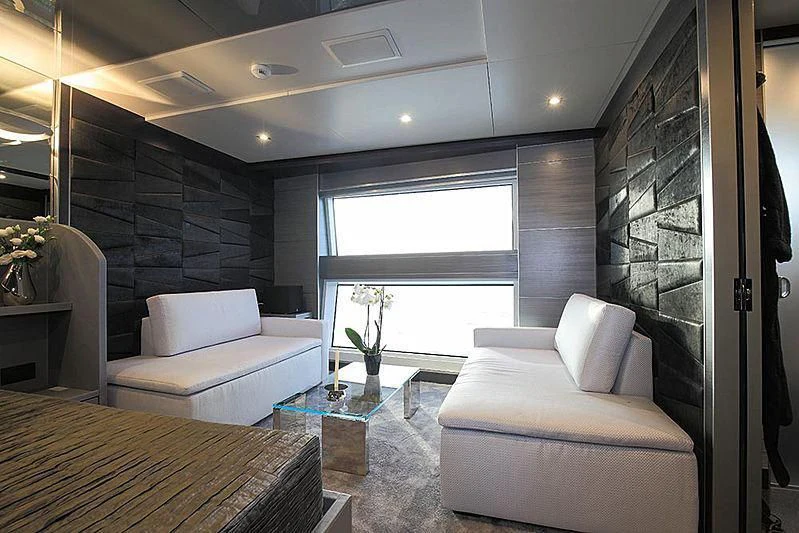 a room with a couch and a table aboard CHARISMA Yacht for Sale