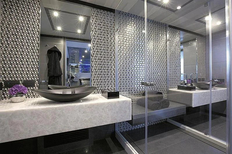 a bathroom with a large mirror aboard CHARISMA Yacht for Sale