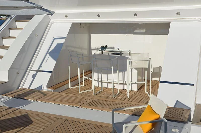 a room with a desk and chairs aboard CHARISMA Yacht for Sale
