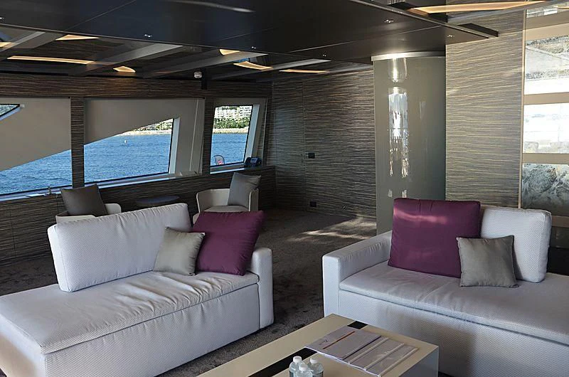 a living room with a large window aboard CHARISMA Yacht for Sale