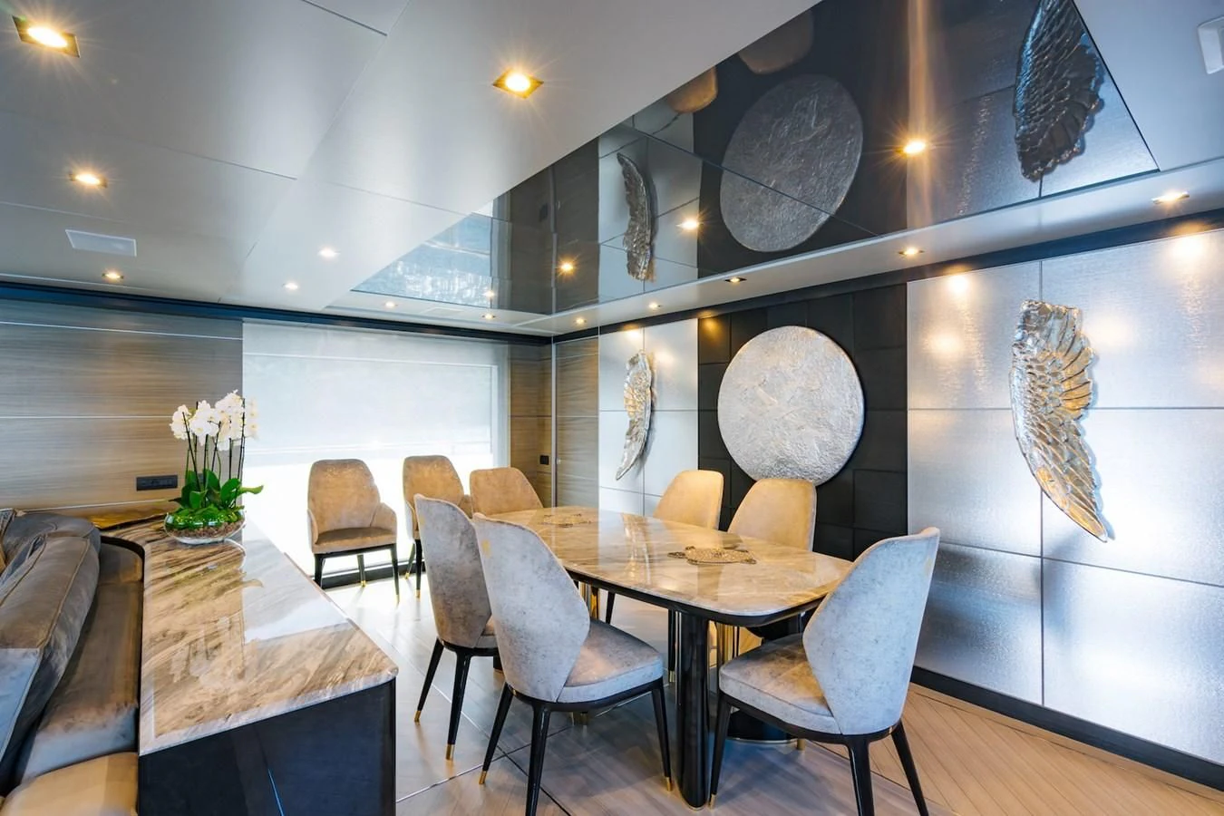 a room with a table and chairs aboard CHARISMA Yacht for Sale