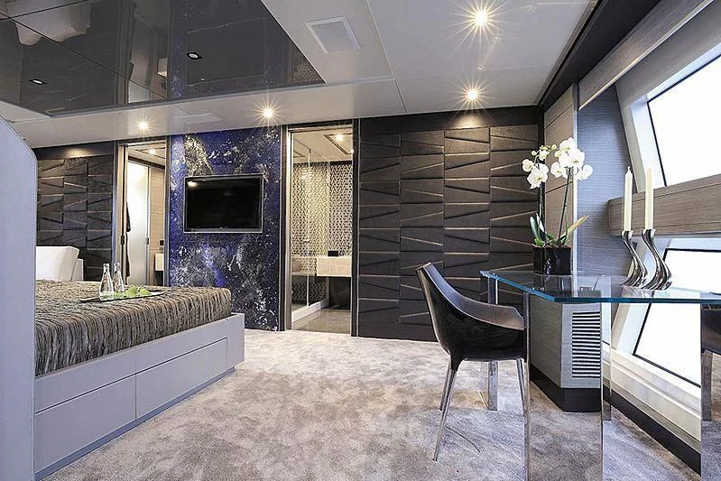 a large bathroom with a large marble counter top and a black chair aboard CHARISMA Yacht for Sale