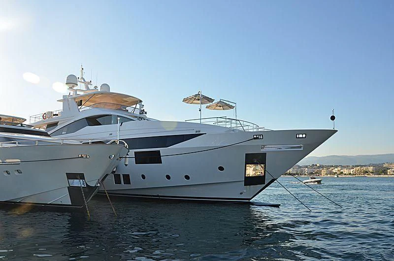 a white yacht in the water aboard CHARISMA Yacht for Sale
