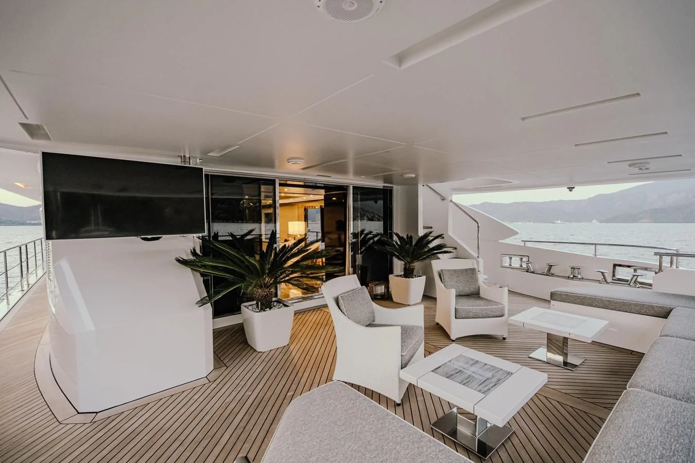 a modern looking living room with a large open floor plan aboard CHARISMA Yacht for Sale