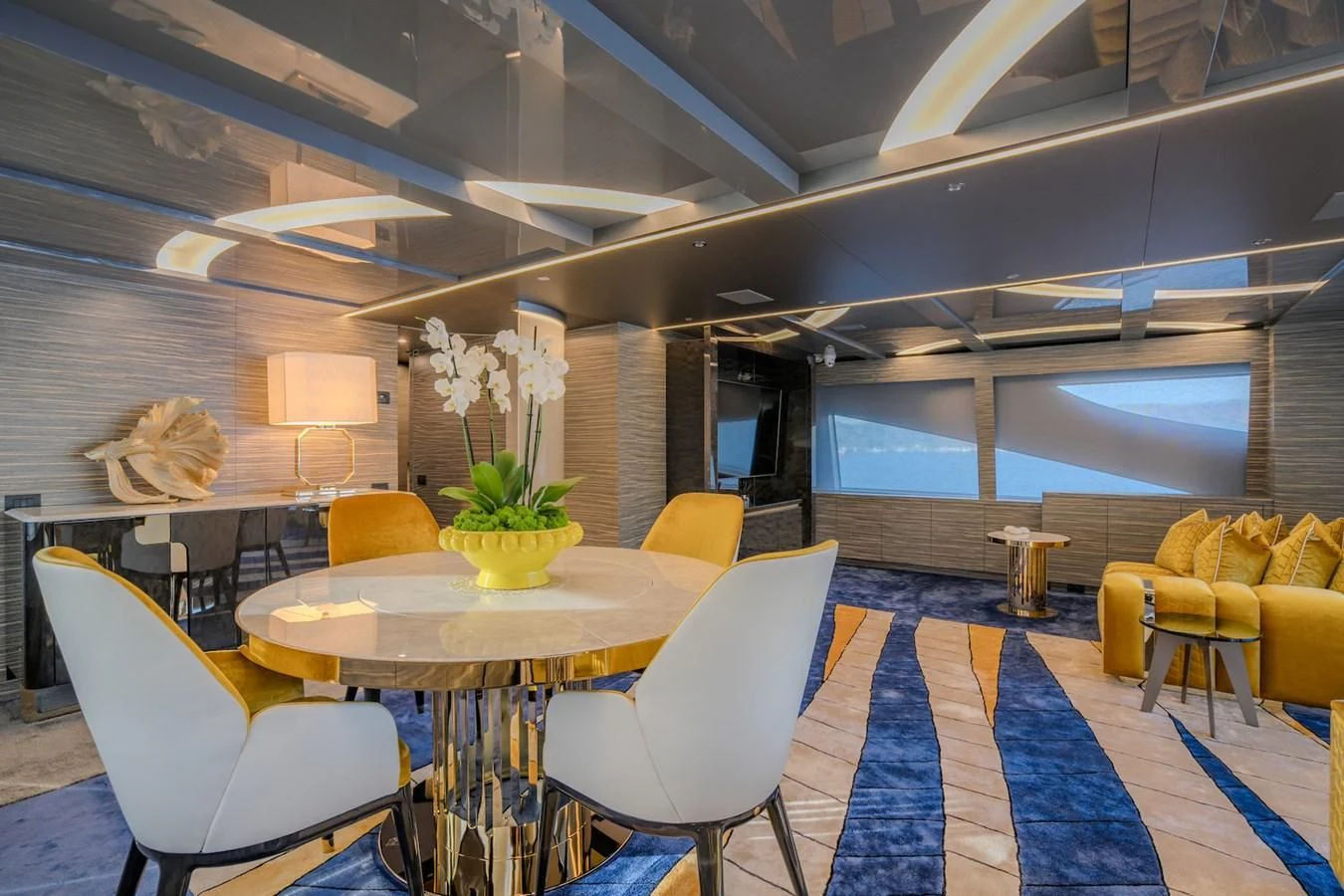 a room with a table and chairs aboard CHARISMA Yacht for Sale