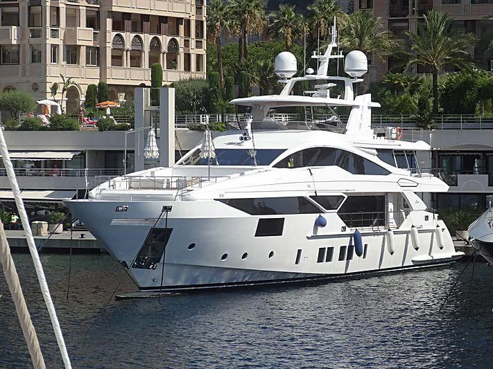 a white yacht docked aboard CHARISMA Yacht for Sale