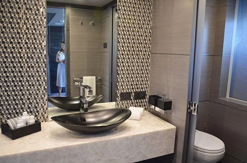 a person standing in a bathroom aboard CHARISMA Yacht for Sale