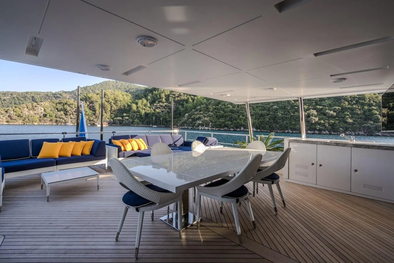 a table and chairs in a room aboard CHARISMA Yacht for Sale