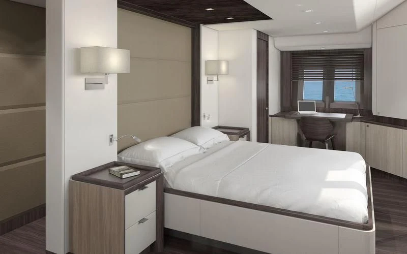 a bedroom with a bed and a desk aboard JONGERT 3200P Yacht for Sale