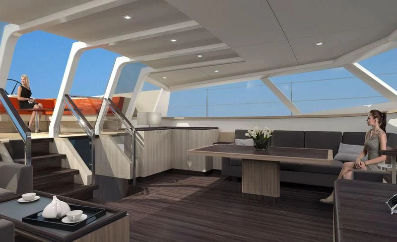 a person sitting on a couch in a room with a table and chairs aboard JONGERT 3200P Yacht for Sale