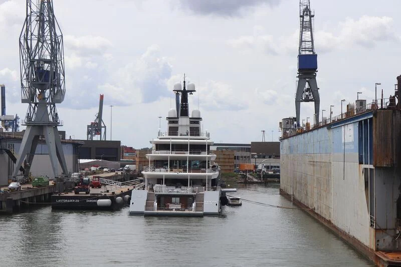 a large ship docked in a harbor aboard SEVEN SEAS Yacht for Sale