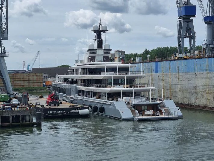 a large white boat docked aboard SEVEN SEAS Yacht for Sale