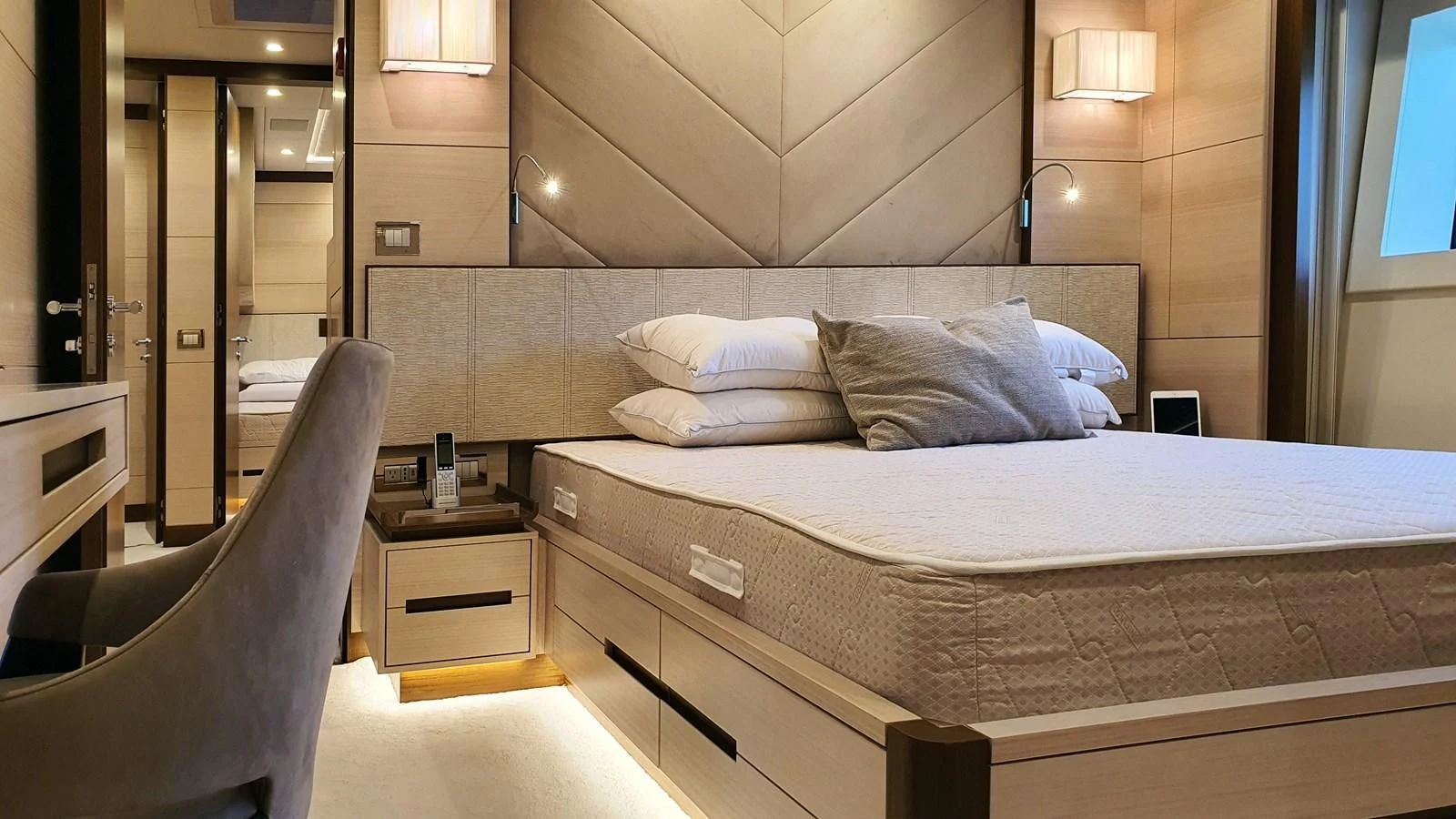 a bed with a white bed aboard CALYPSO Yacht for Charter