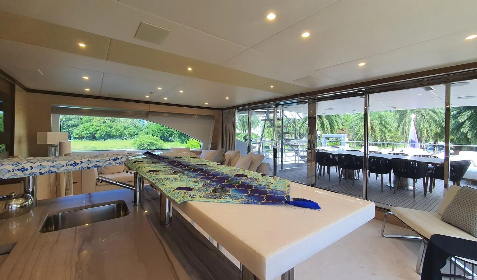 a large room with a table and chairs aboard CALYPSO Yacht for Charter