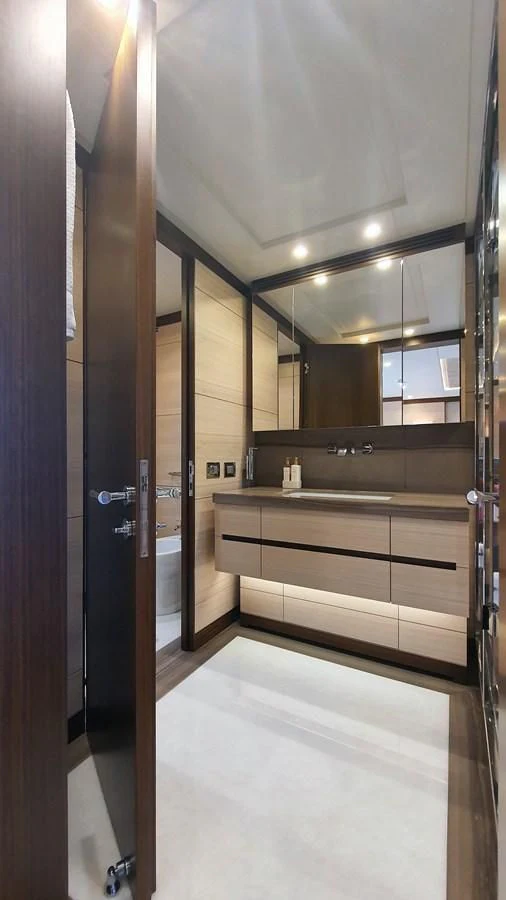 a bathroom with a large mirror aboard CALYPSO Yacht for Charter