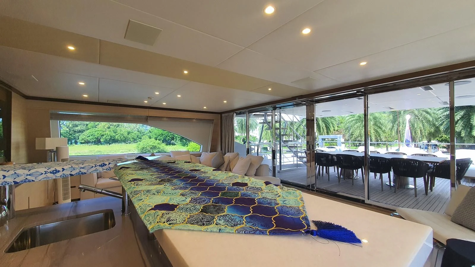 a large room with a pool table and chairs aboard CALYPSO Yacht for Charter