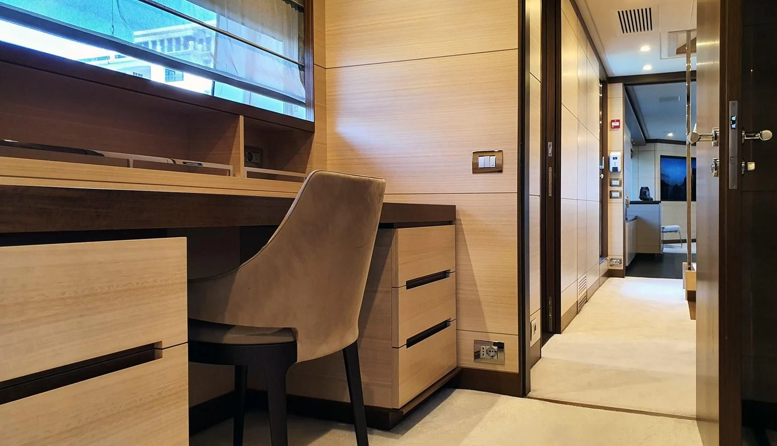a room with a chair and desk aboard CALYPSO Yacht for Charter