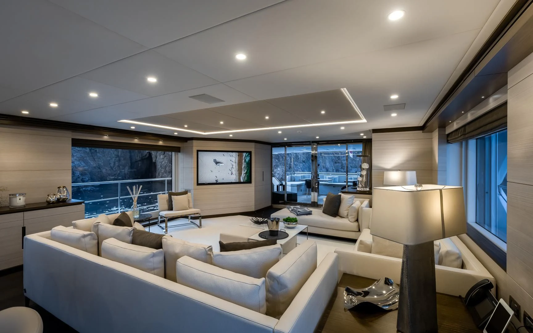 a living room with a large window aboard CALYPSO Yacht for Charter