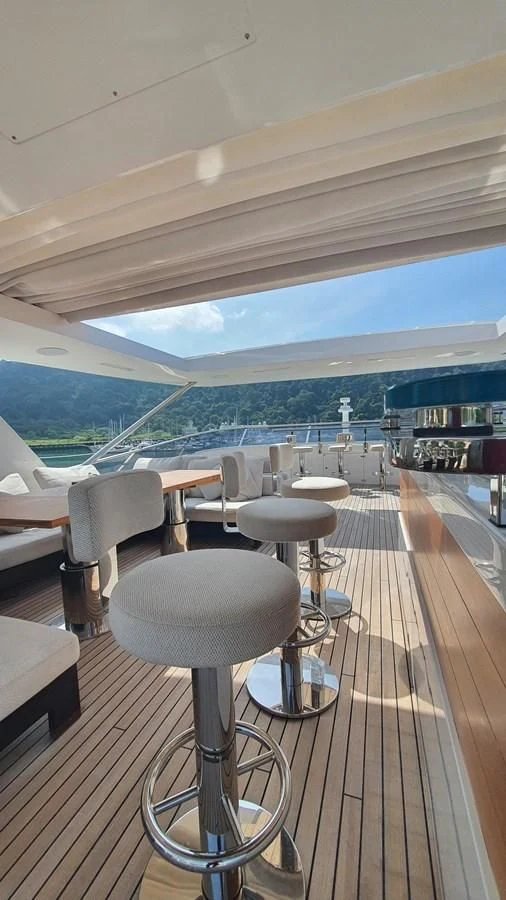 a room with chairs and tables aboard CALYPSO Yacht for Charter