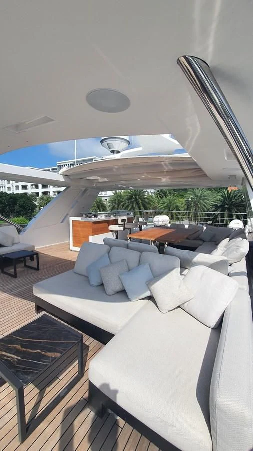 a room with a couch and a table and chairs aboard CALYPSO Yacht for Charter