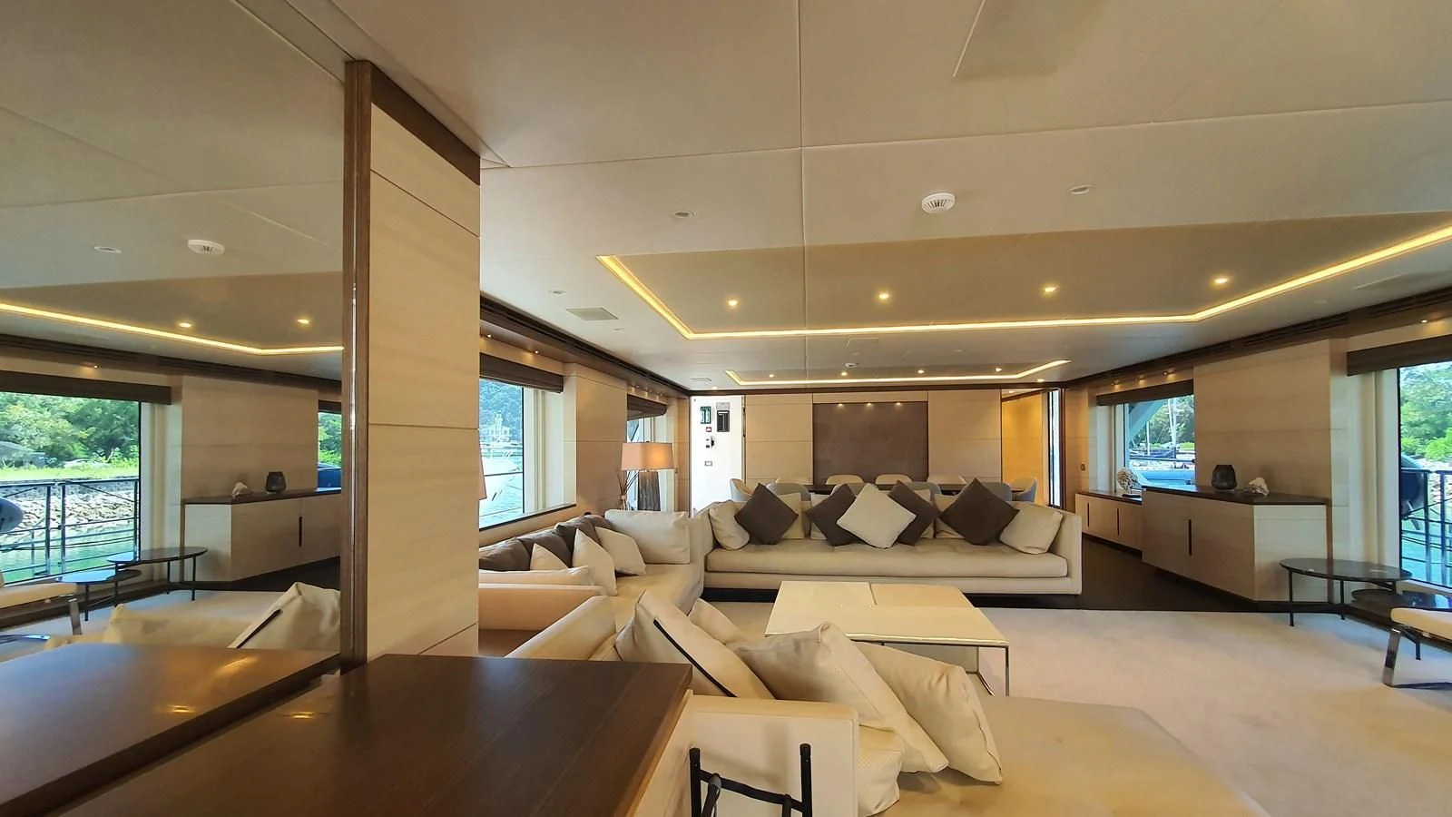 a large living room with a large window aboard CALYPSO Yacht for Charter