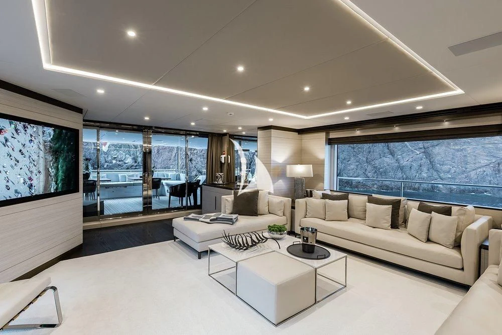 a living room with a large window aboard CALYPSO Yacht for Charter
