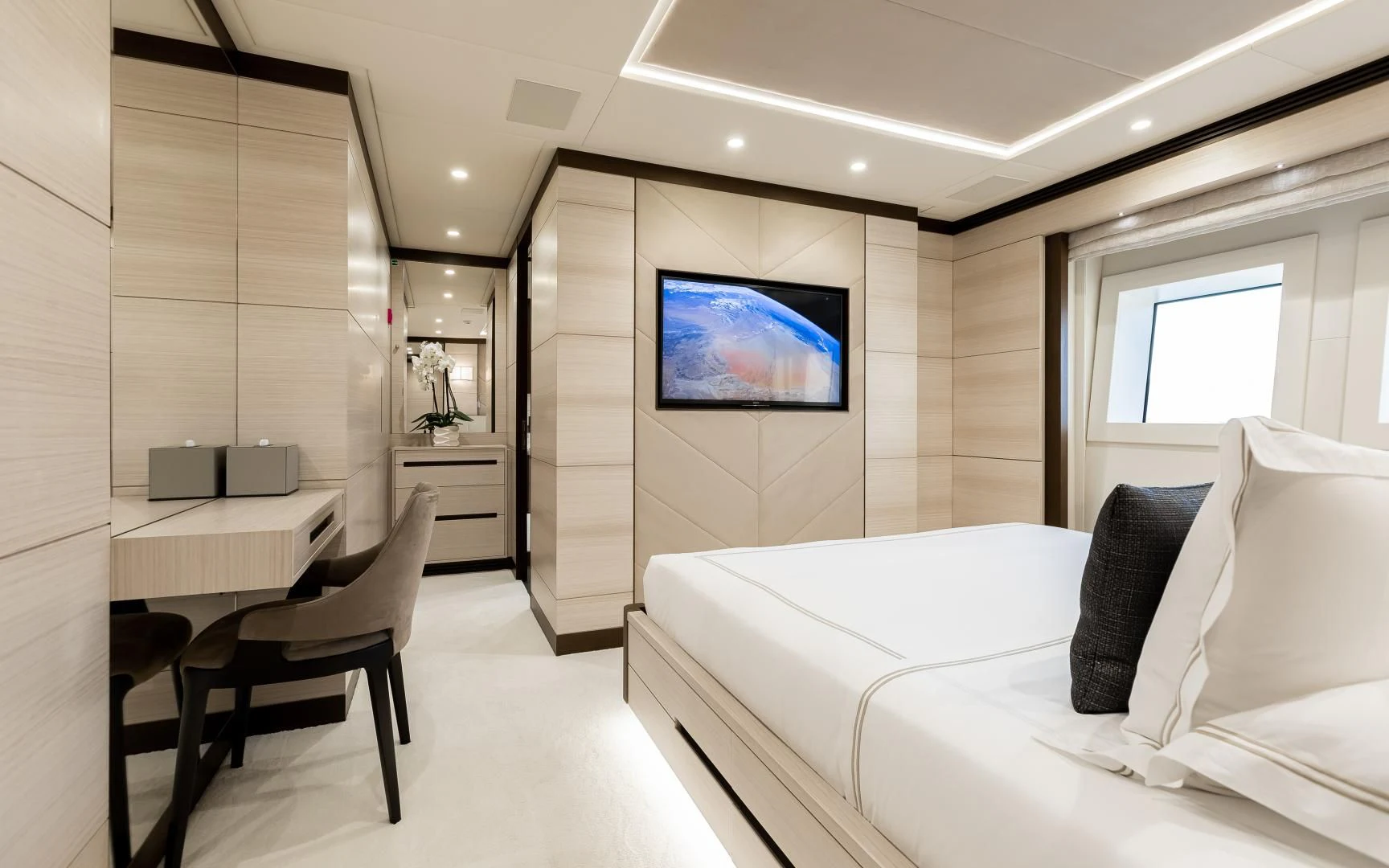 a room with a bed and a tv on the wall aboard CALYPSO Yacht for Charter
