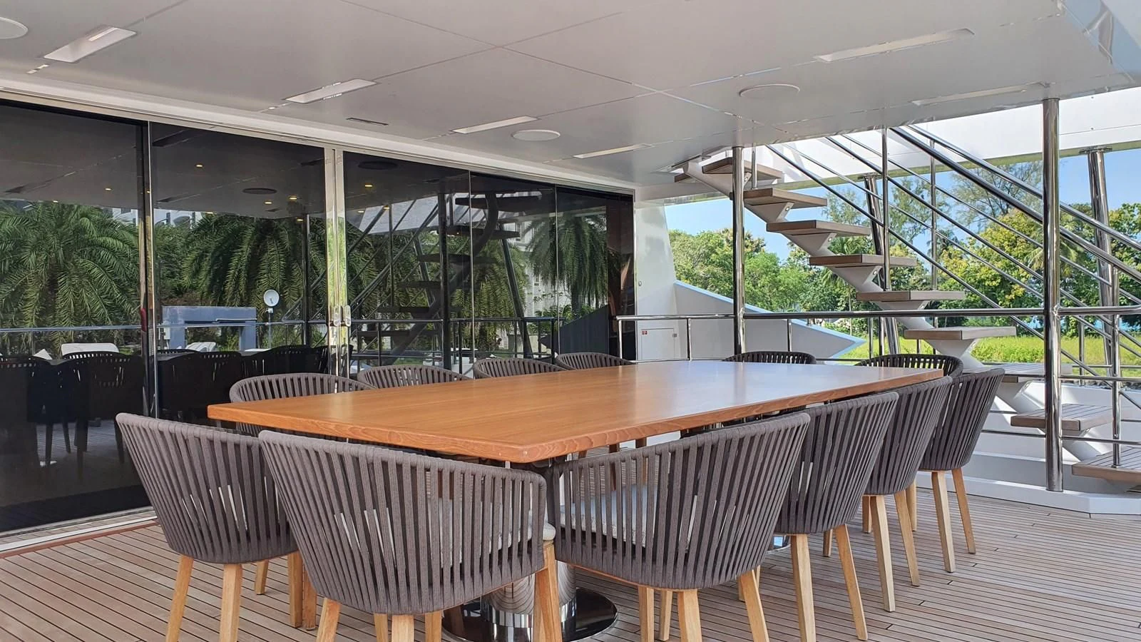a room with tables and chairs aboard CALYPSO Yacht for Charter
