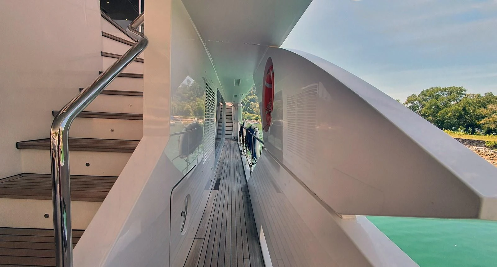 a large white building with a staircase aboard CALYPSO Yacht for Charter