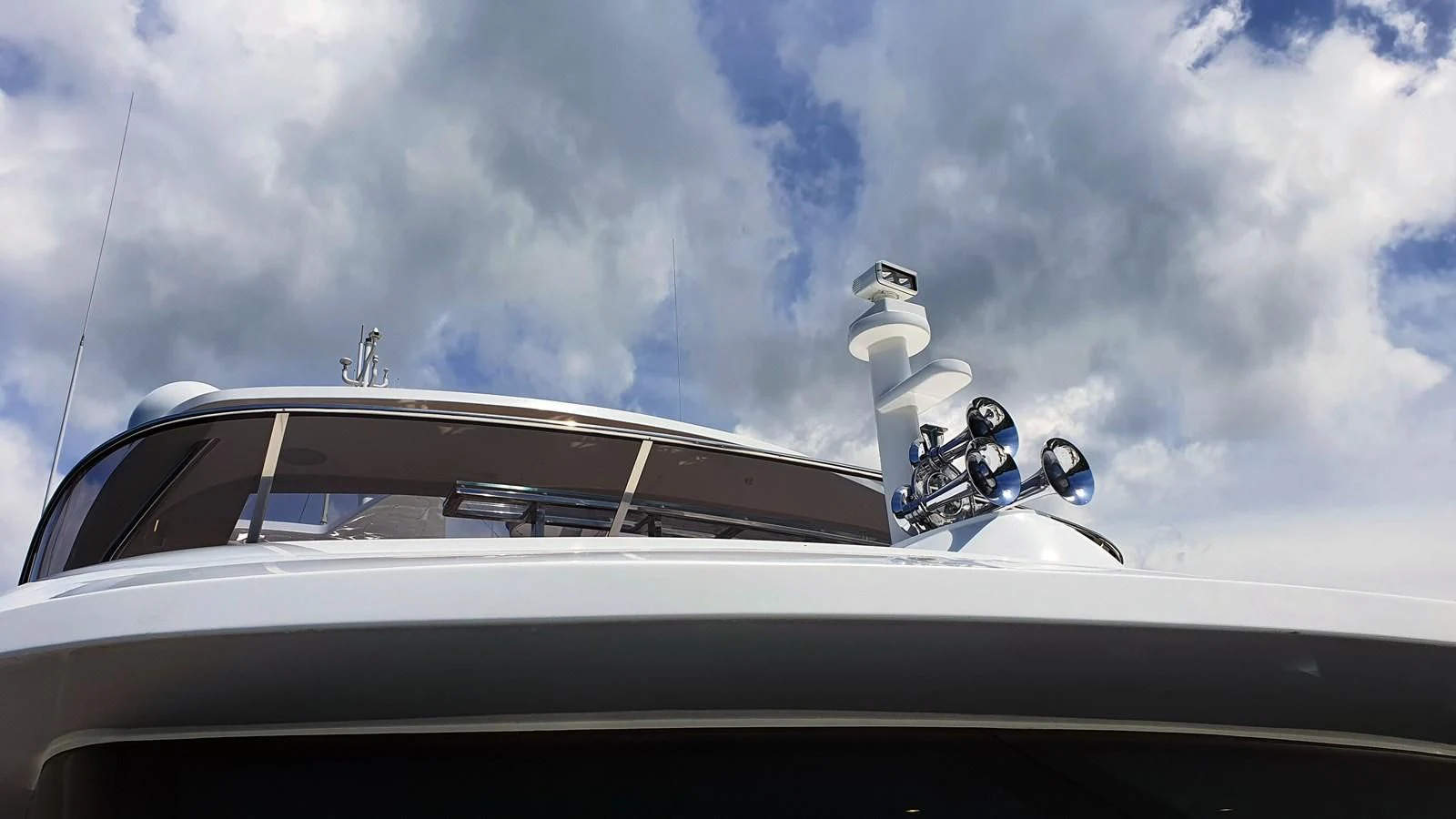 a car with a person on the hood aboard CALYPSO Yacht for Charter