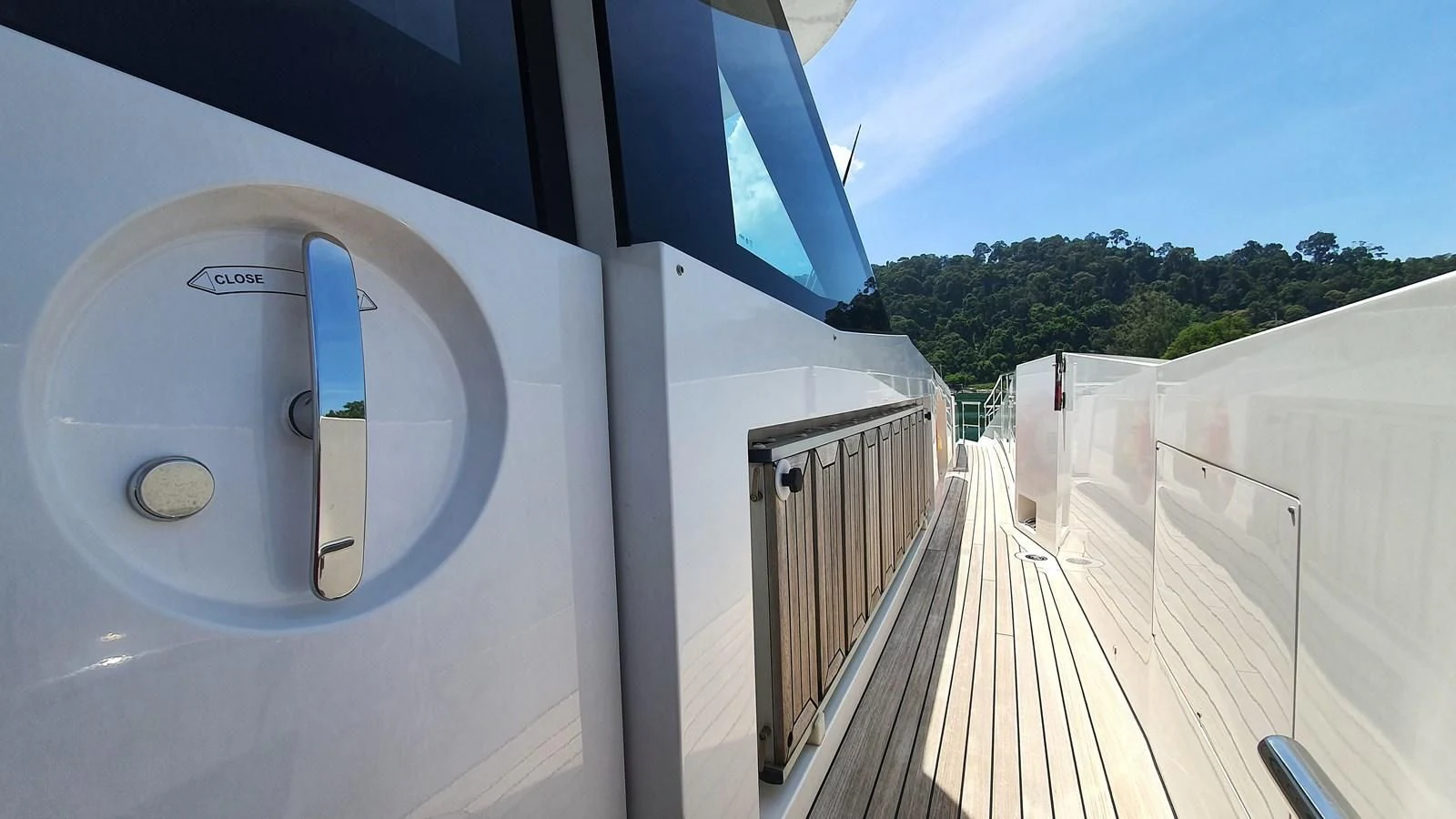 a white building with a balcony aboard CALYPSO Yacht for Charter