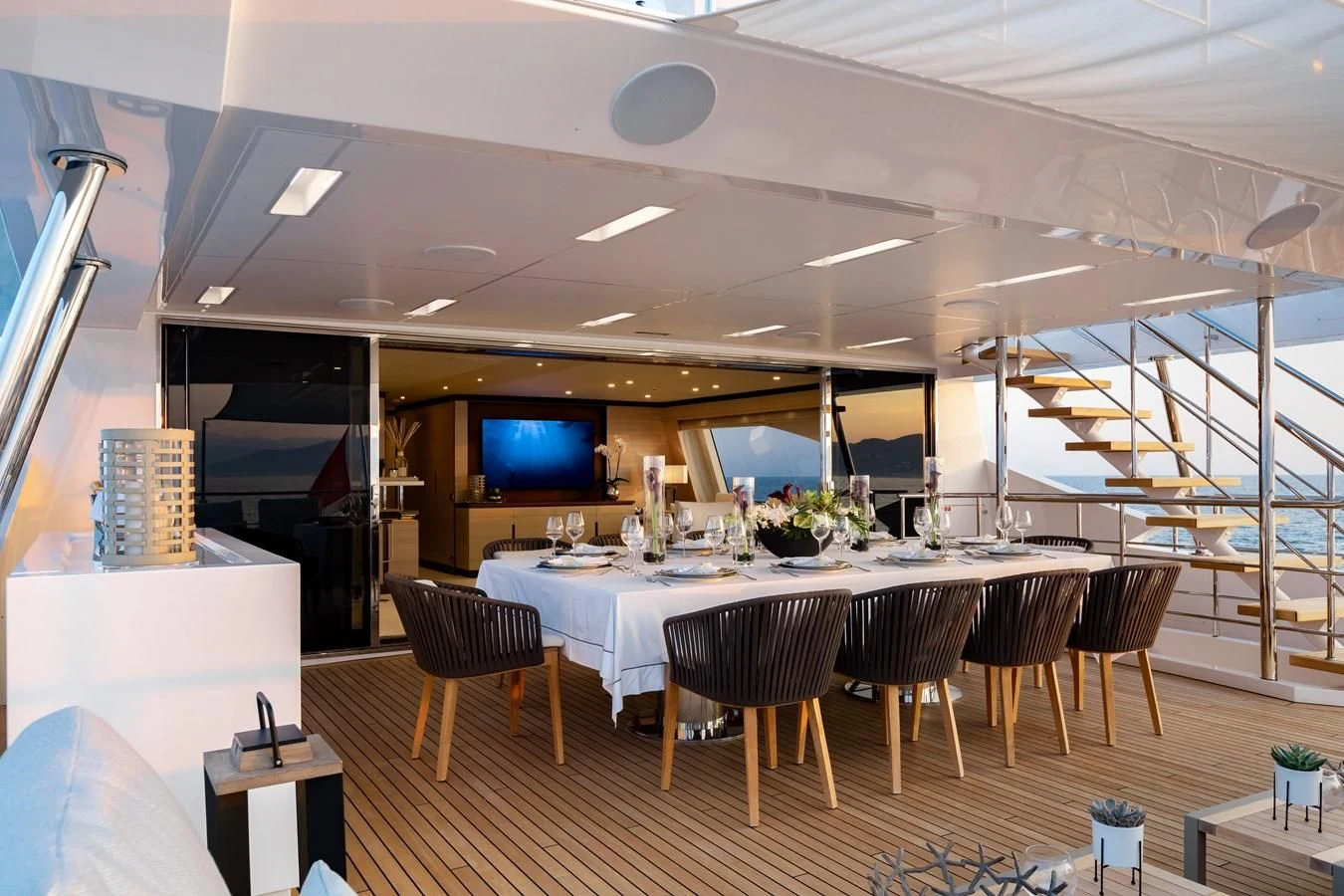a large room with a table and chairs aboard CALYPSO Yacht for Charter