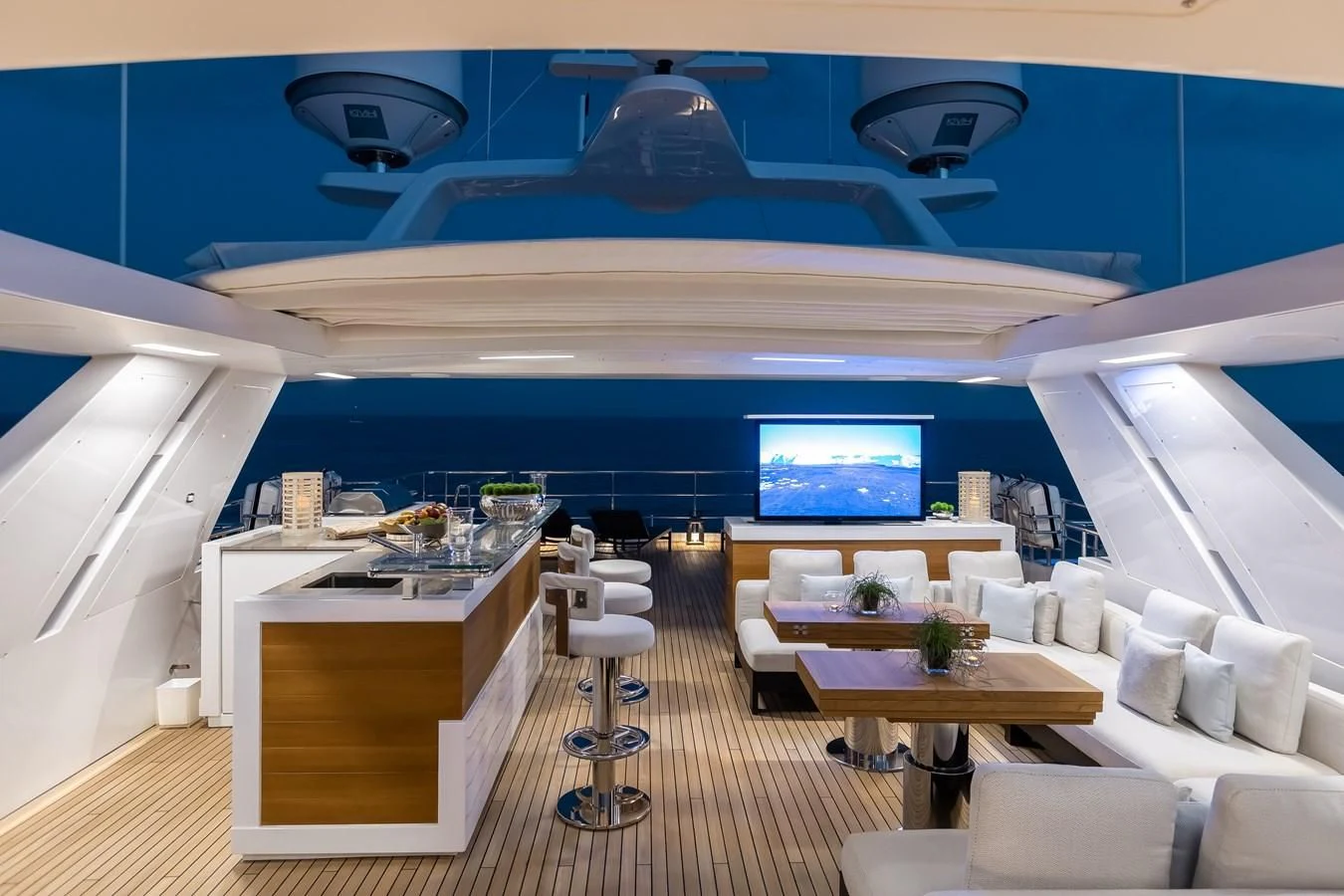 inside of a building with a large window and a table and chairs aboard CALYPSO Yacht for Charter