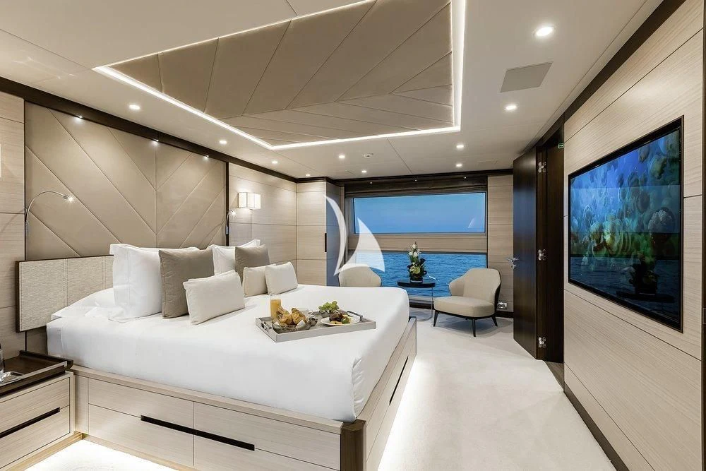 a modern bedroom with a large window aboard CALYPSO Yacht for Charter