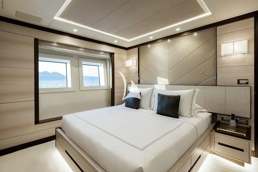 a bed in a room aboard CALYPSO Yacht for Charter