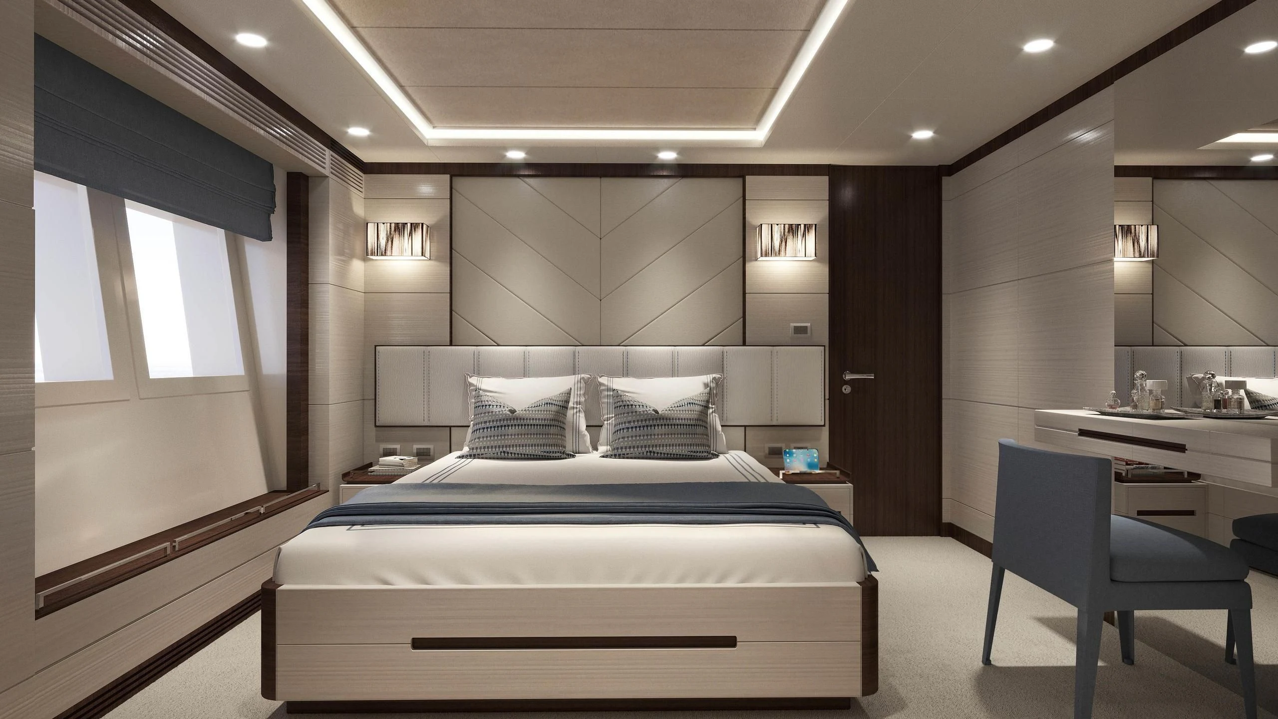 a room with a bed and desk aboard CALYPSO Yacht for Charter