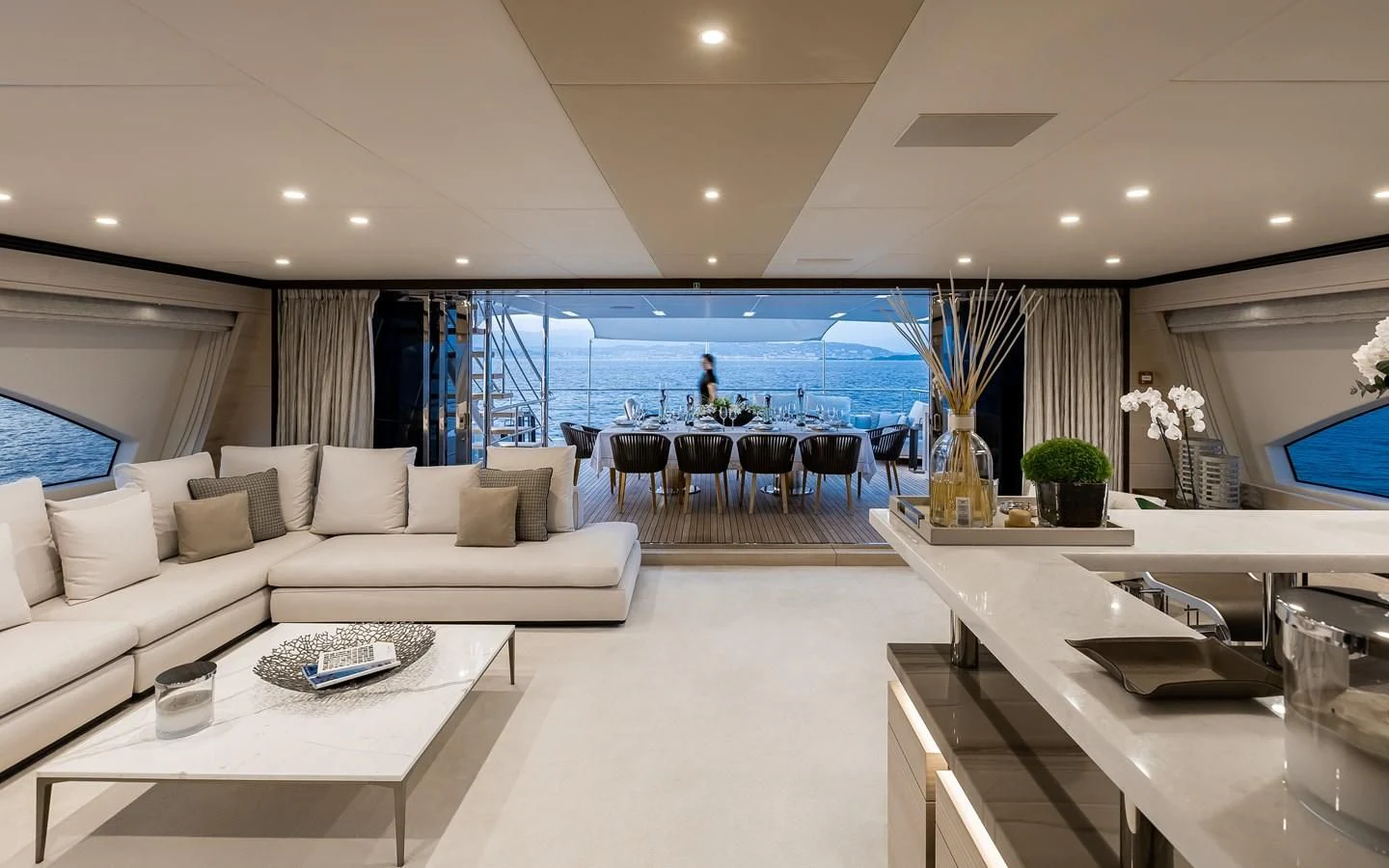 a living room with a large balcony aboard CALYPSO Yacht for Charter