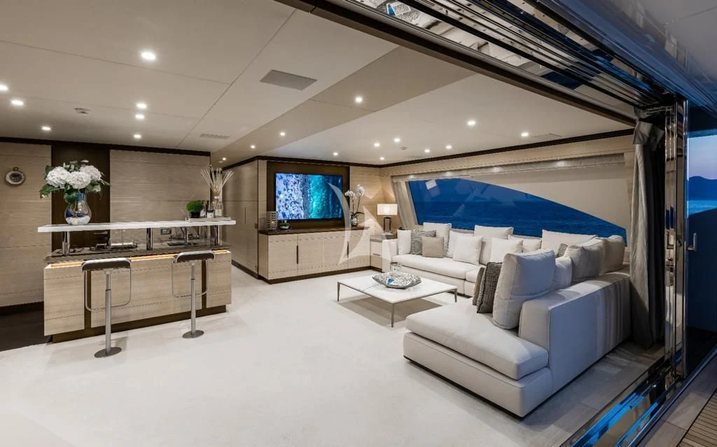 a large living room with a large screen aboard CALYPSO Yacht for Charter