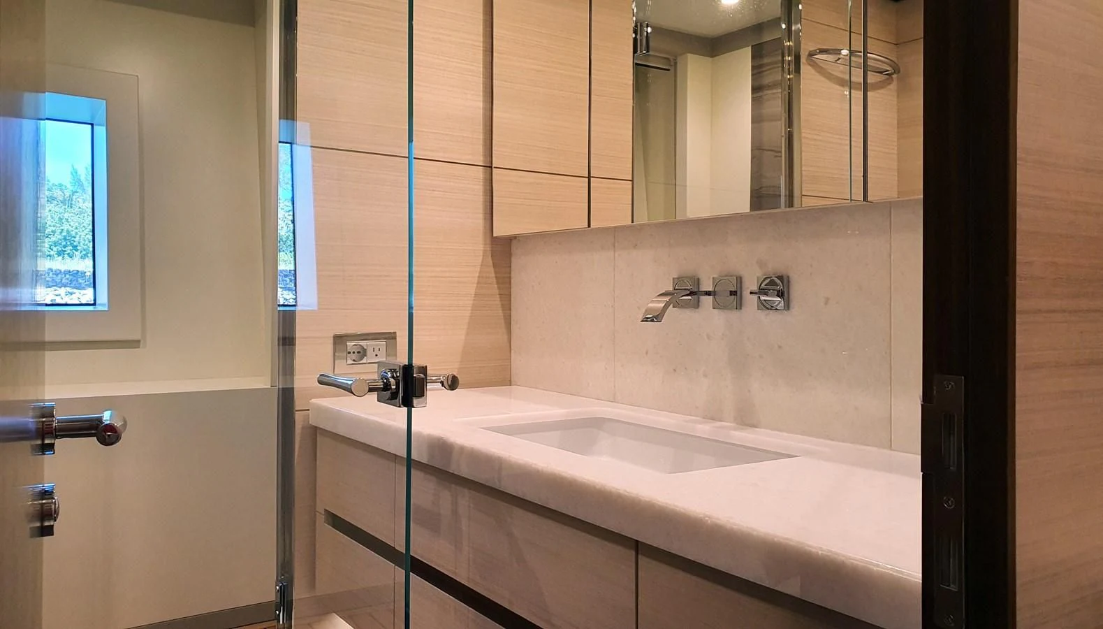 a bathroom with a sink and a mirror aboard CALYPSO Yacht for Charter