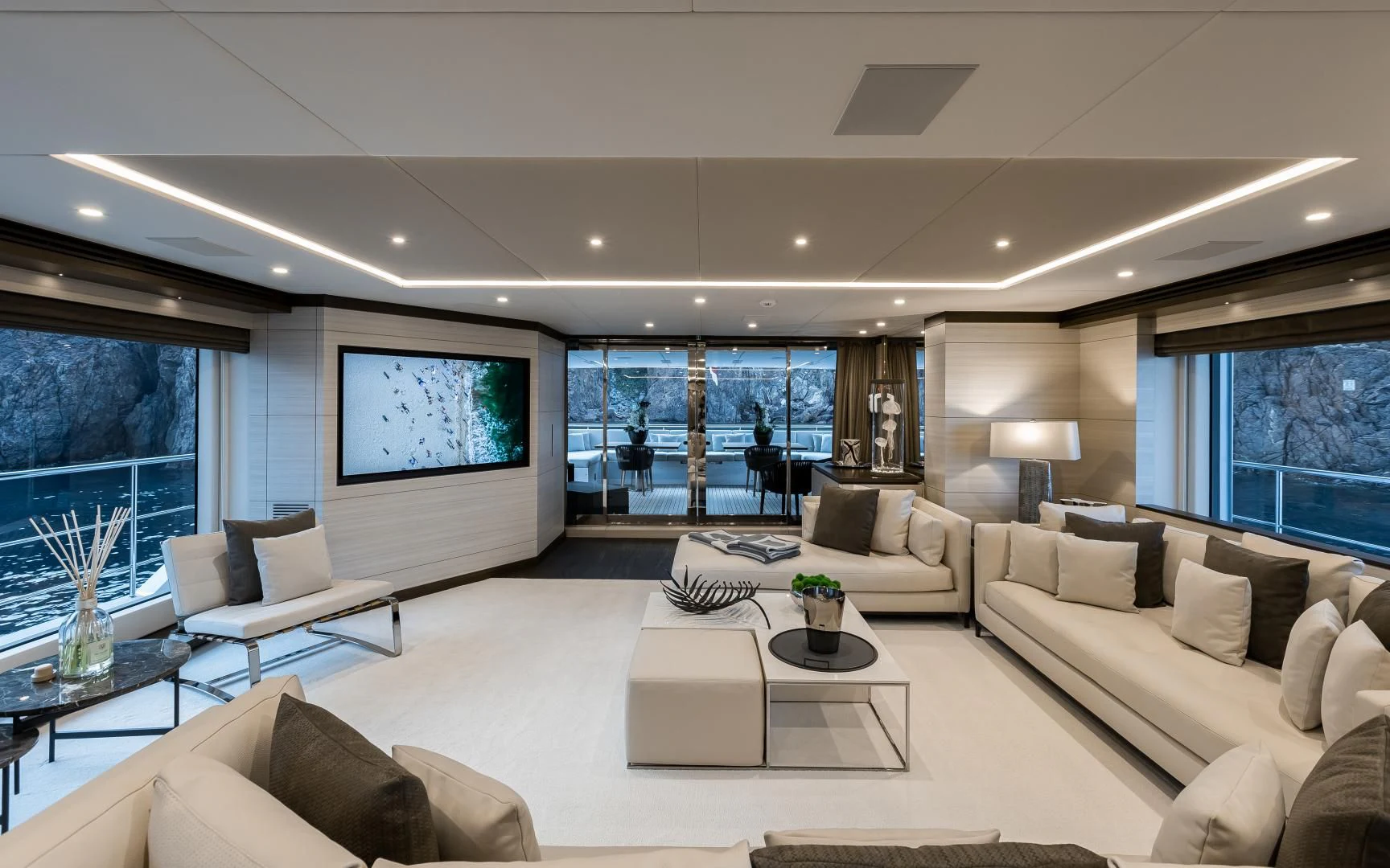 a living room with a large screen aboard CALYPSO Yacht for Charter