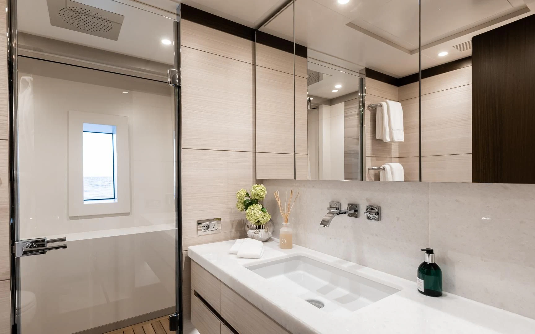 a bathroom with a large mirror aboard CALYPSO Yacht for Charter