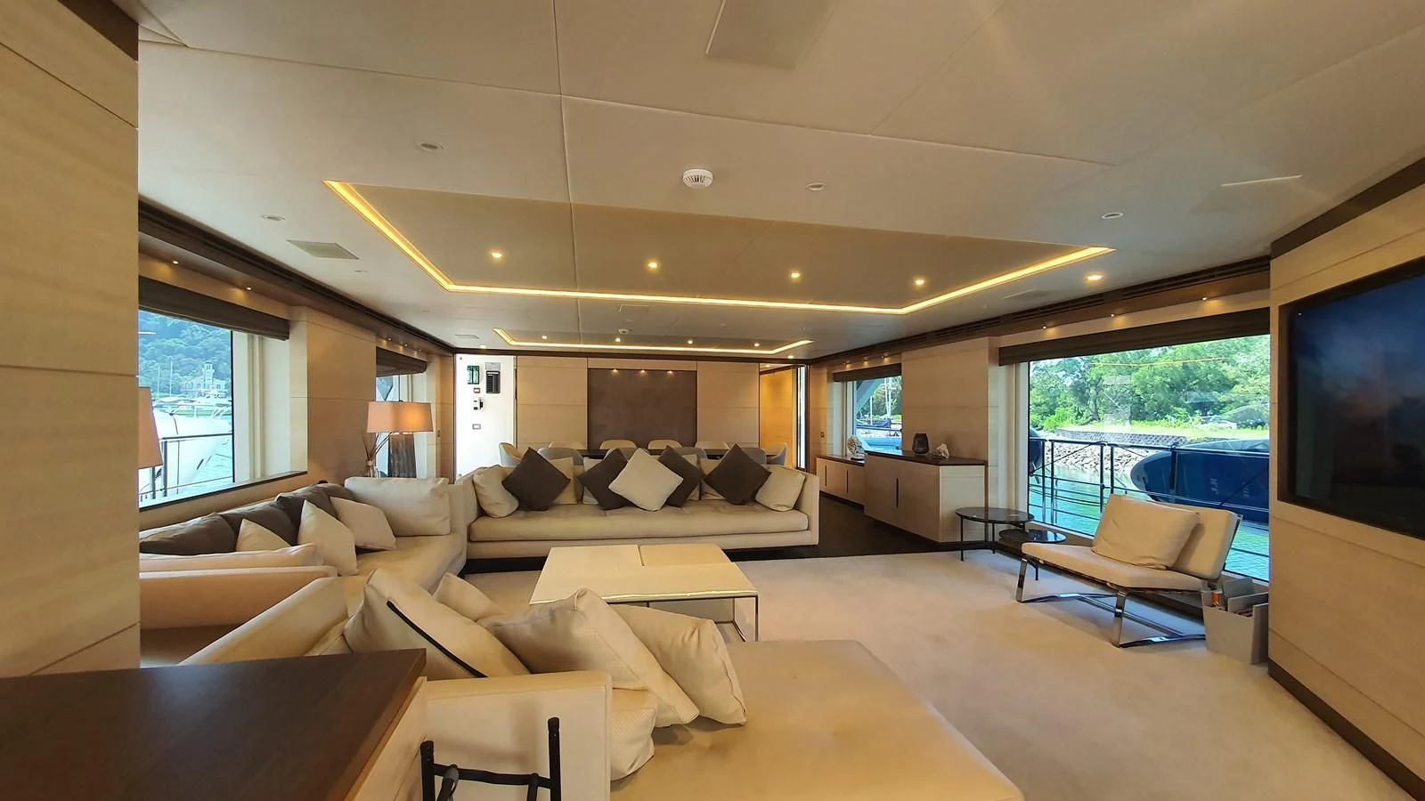 a living room with a large window aboard CALYPSO Yacht for Charter