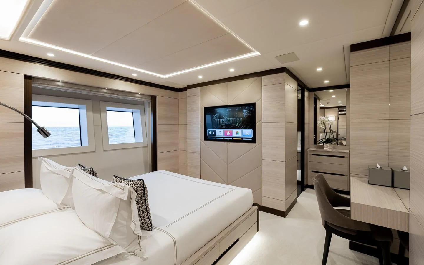 a room with a bed and a tv on the wall aboard CALYPSO Yacht for Charter