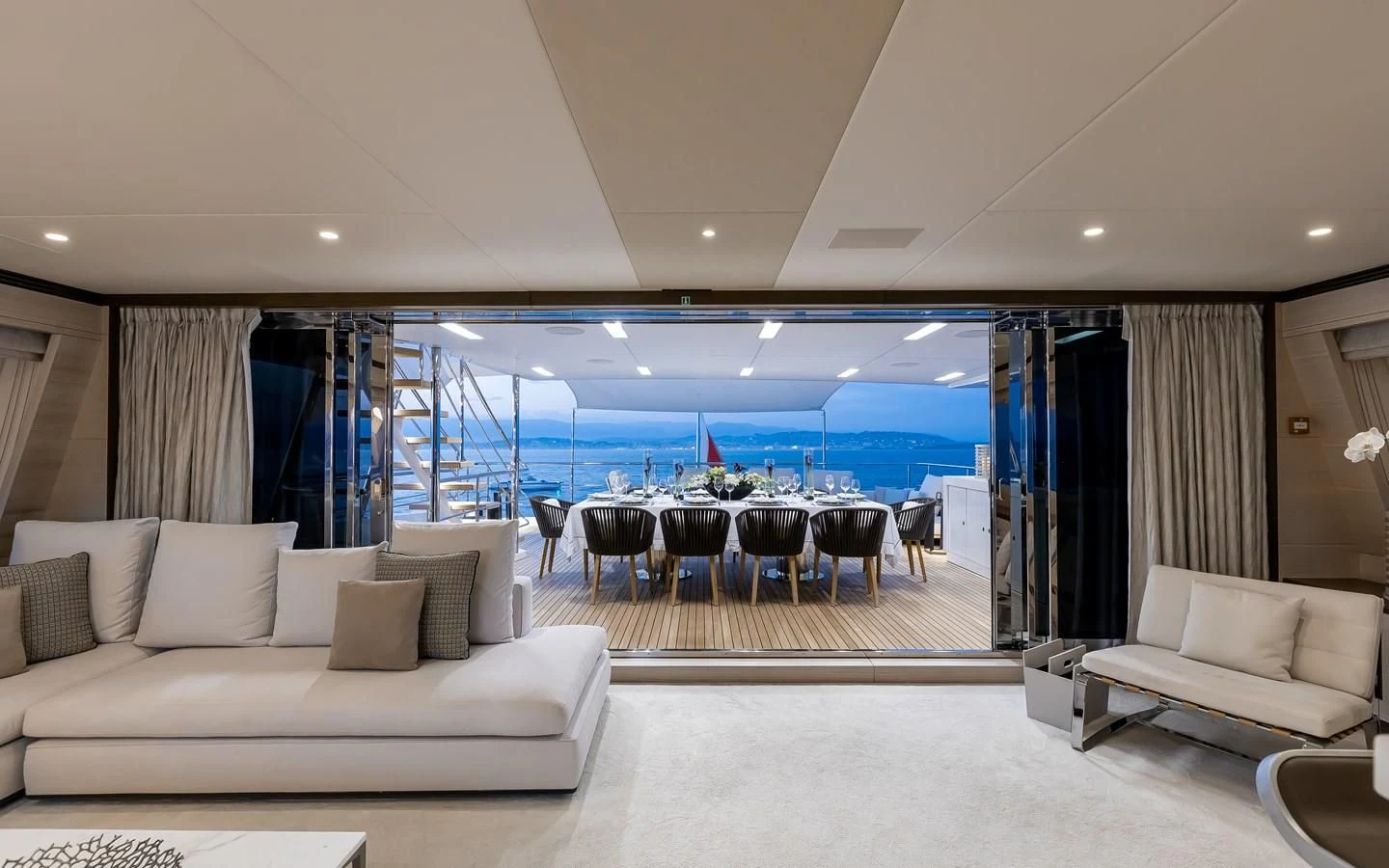 a living room with a large swimming pool aboard CALYPSO Yacht for Charter